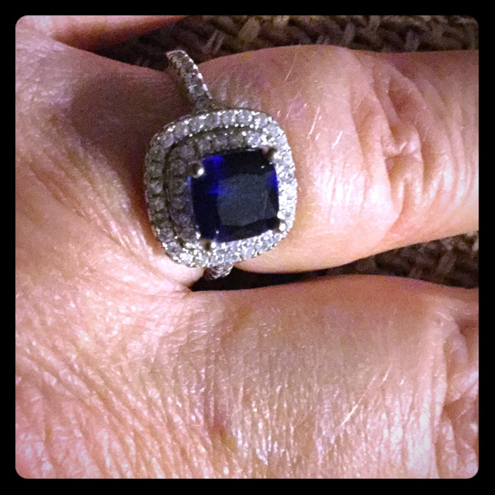 Faux sapphire. Stamped .925 on band . Size 6.
